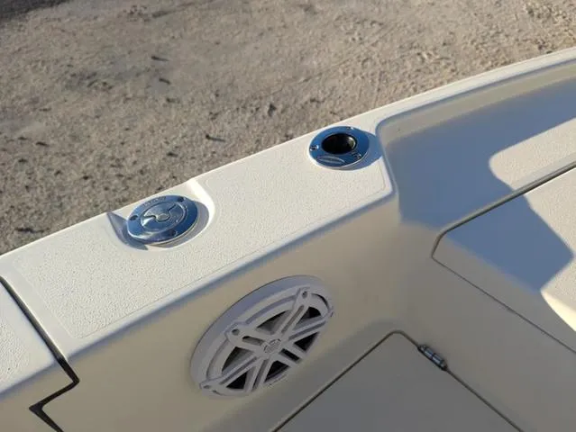 Slide: The Image of 2025 Pathfinder 2500 Hybrid boat interior with speaker and cup holder. - 24