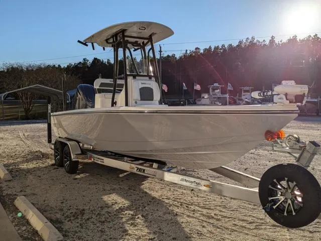 Slide: The Image of 2025 Pathfinder 2500 Hybrid boat on trailer in sunny outdoor setting. - 3