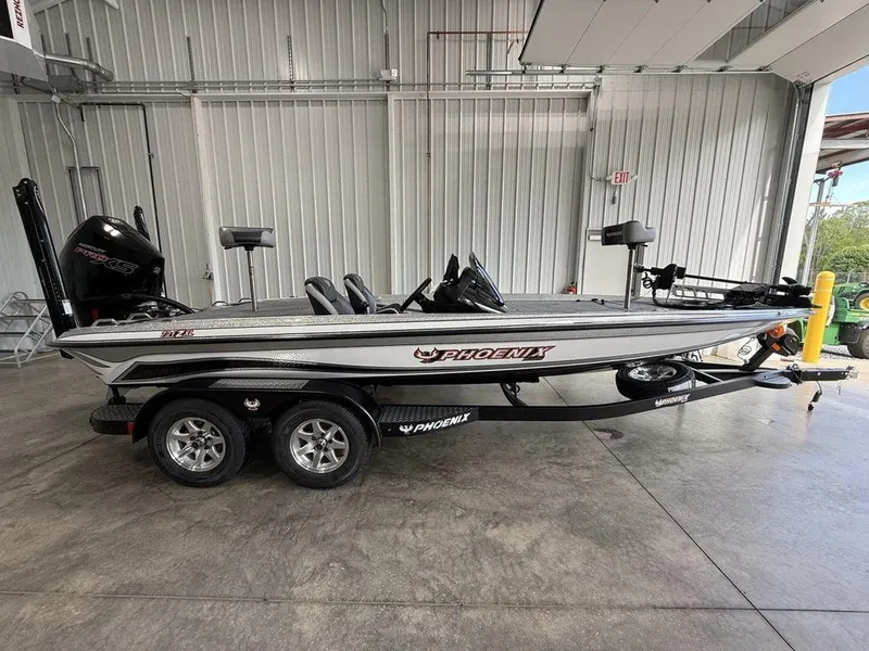 The Image of 2025 Phoenix 721 ZXL boat in a garage, side view, on a trailer. - 1