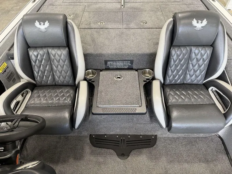 Slide: The Image of 2025 Phoenix 721 ZXL boat interior with two cushioned seats and storage compartment. - 13