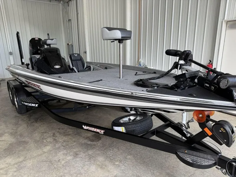 Slide: The Image of 2025 Phoenix 721 ZXL fishing boat in a garage, featuring a sleek design and modern equipment. - 2