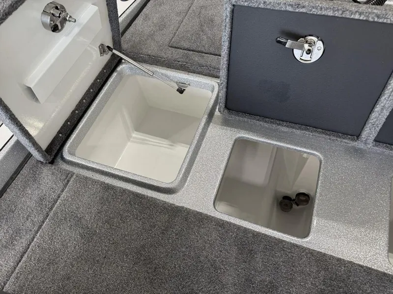 Slide: The Image of 2025 Phoenix 721 ZXL boat storage compartments with open lids, showcasing interior design. - 21