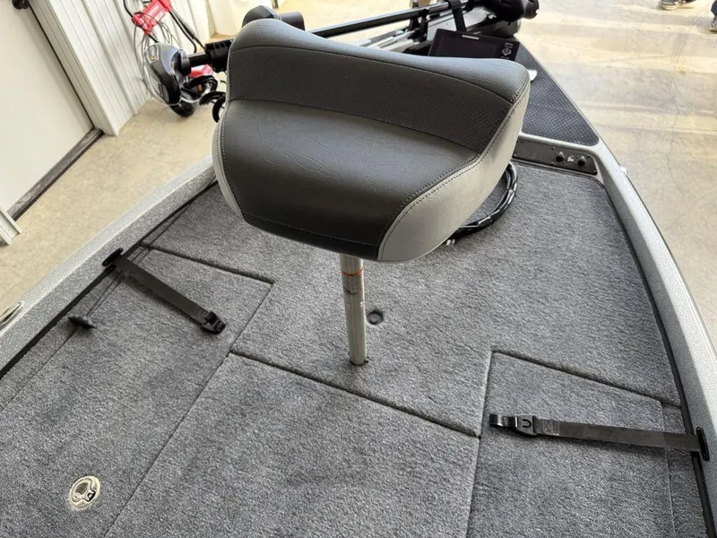 Slide: The Image of 2025 Phoenix 721 ZXL boat deck with a cushioned seat and carpeted surface. - 8