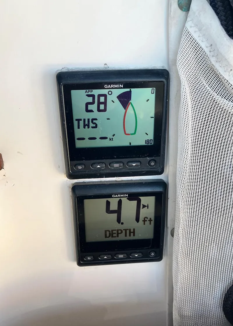 Slide: The Image of Garmin marine instruments displaying wind angle and water depth on a 1983 Freedom Cat Ketch. - 17