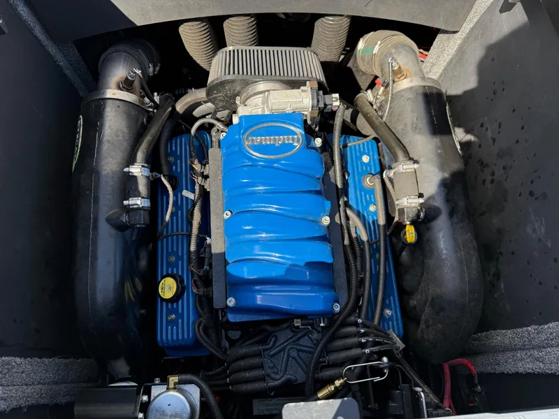 Slide: The Image of 2014 Supra Launch SC350-550 engine with blue cover and black components. - 10