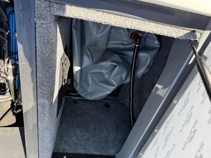 Slide: The Image of 2014 Supra Launch SC350-550 storage compartment with gray interior and equipment. - 11