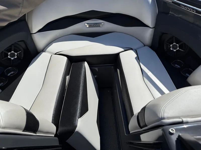 Slide: The Image of 2014 Supra Launch SC350-550 boat interior with black and white seating. - 12
