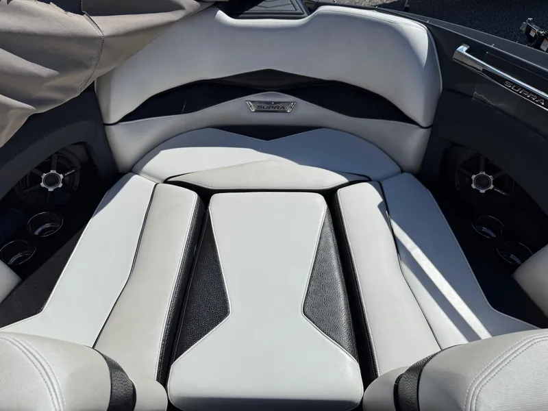 Slide: The Image of 2014 Supra Launch SC350-550 boat interior with sleek, modern seating design. - 13
