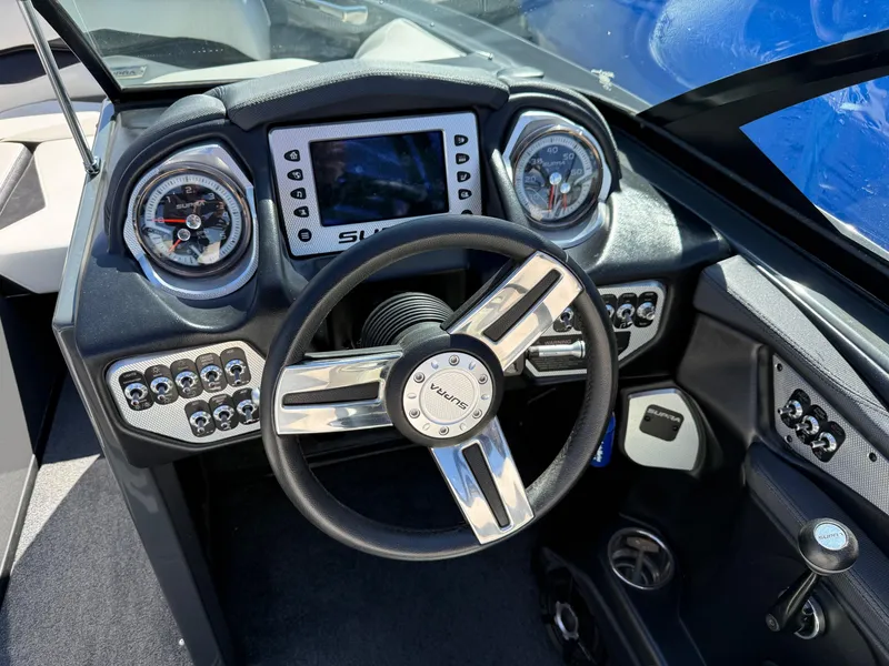 Slide: The Image of 2014 Supra Launch SC350-550 dashboard with steering wheel and control panel. - 15