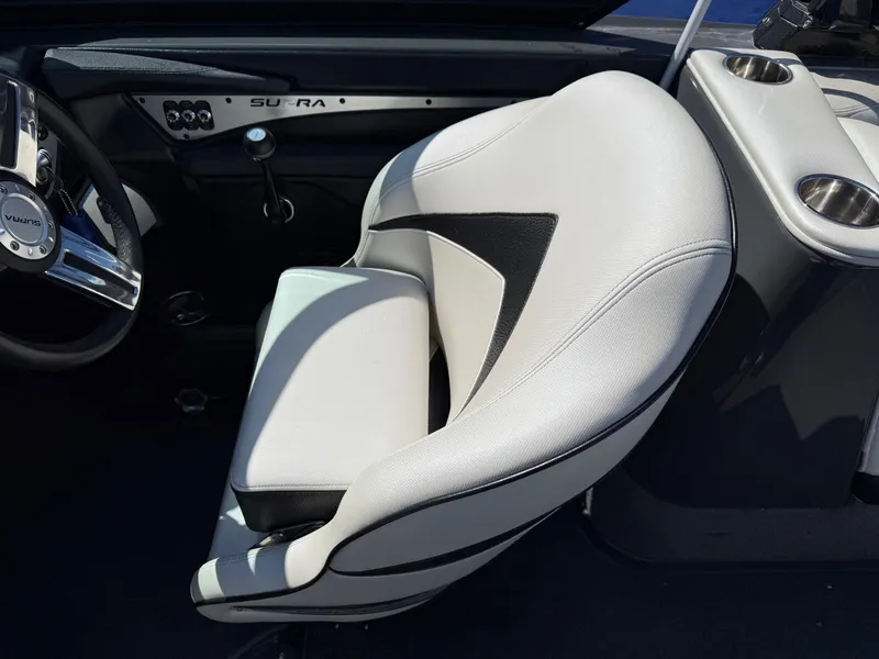 Slide: The Image of 2014 Supra Launch SC350-550 boat interior with white leather seat and steering wheel. - 5