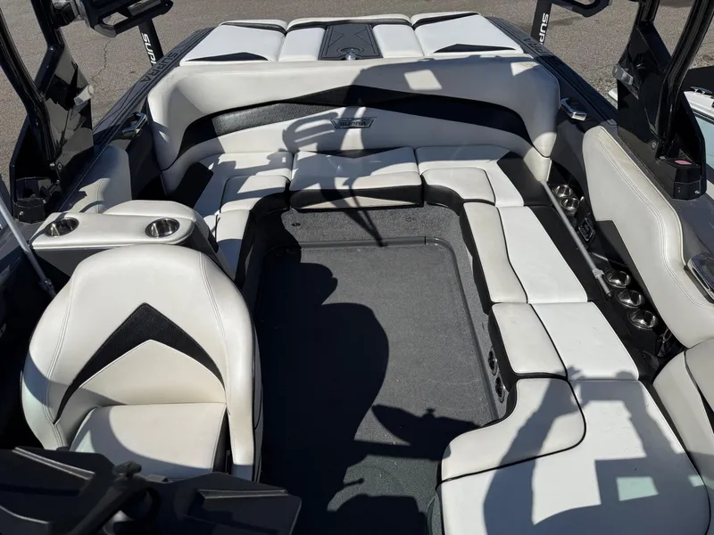 Slide: The Image of 2014 Supra Launch SC350-550 boat interior with white and black seating arrangement. - 6