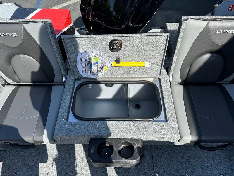 Slide: The Image of 2025 Lund 1675 Adventure SS boat interior with storage compartment and seating. - 12