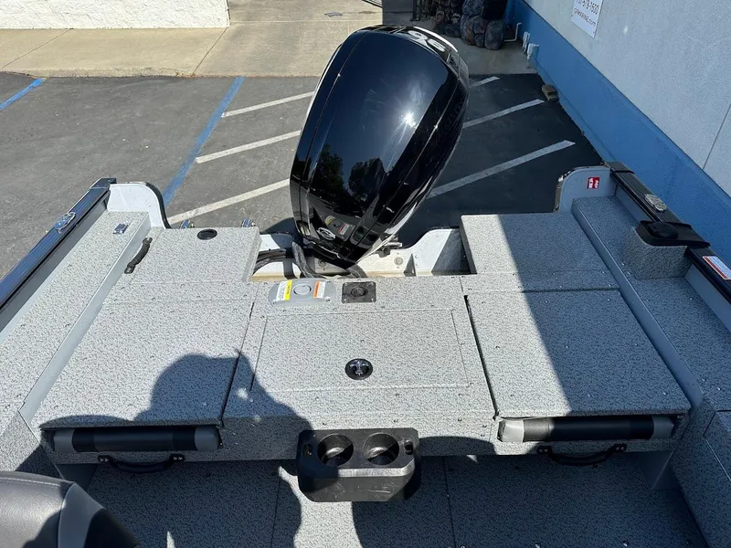 Slide: The Image of 2025 Lund 1675 Adventure SS boat with outboard motor in parking lot. - 26