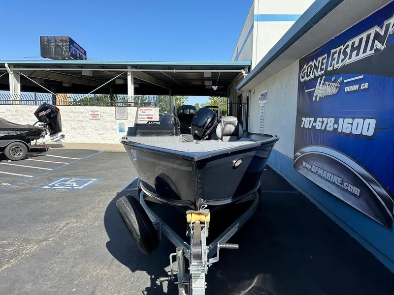 Slide: The Image of 2025 Lund 1675 Adventure SS boat on trailer at dealership parking lot. - 3