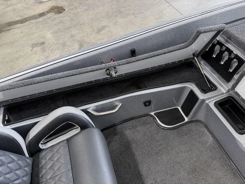 Slide: The Image of Interior of 2025 Phoenix 920 Elite II boat, featuring sleek seating and storage compartments. - 12