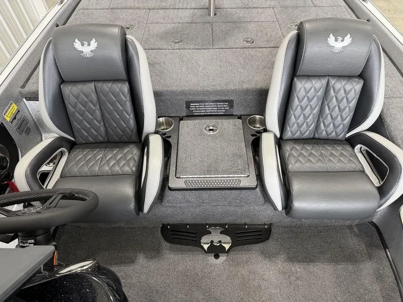Slide: The Image of 2025 Phoenix 920 Elite II boat interior with two gray leather seats and center console. - 15