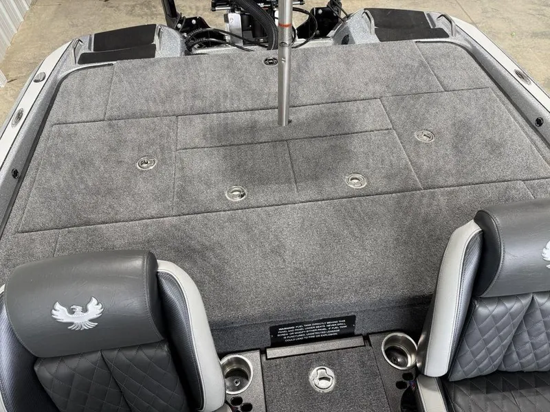 Slide: The Image of 2025 Phoenix 920 Elite II boat interior with gray seating and storage compartments. - 18