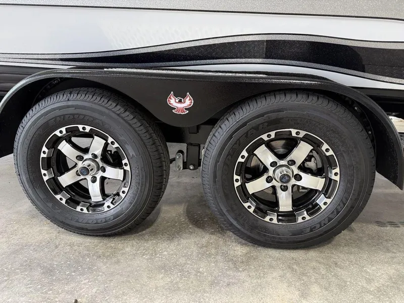 Slide: The Image of 2025 Phoenix 920 Elite II trailer wheels with sleek black and silver rims. - 4