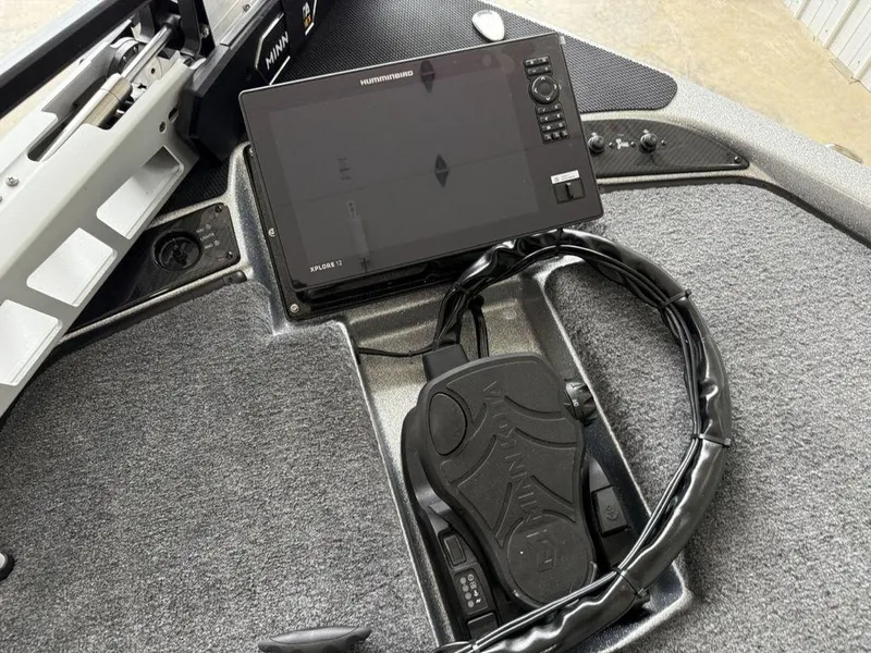 Slide: The Image of 2025 Phoenix 920 Elite II boat dashboard with advanced navigation system and controls. - 6