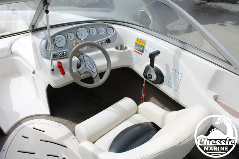 Slide: The Image of 2007 Tahoe Q6 boat cockpit with steering wheel, gauges, and throttle control. - 12