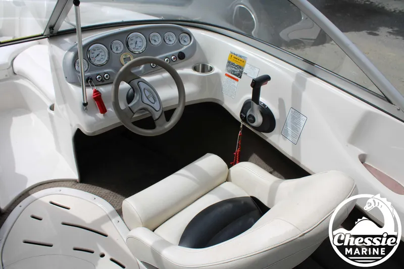 Slide: The Image of Interior of a 2007 Tahoe Q6 boat with steering wheel and dashboard controls. - 13