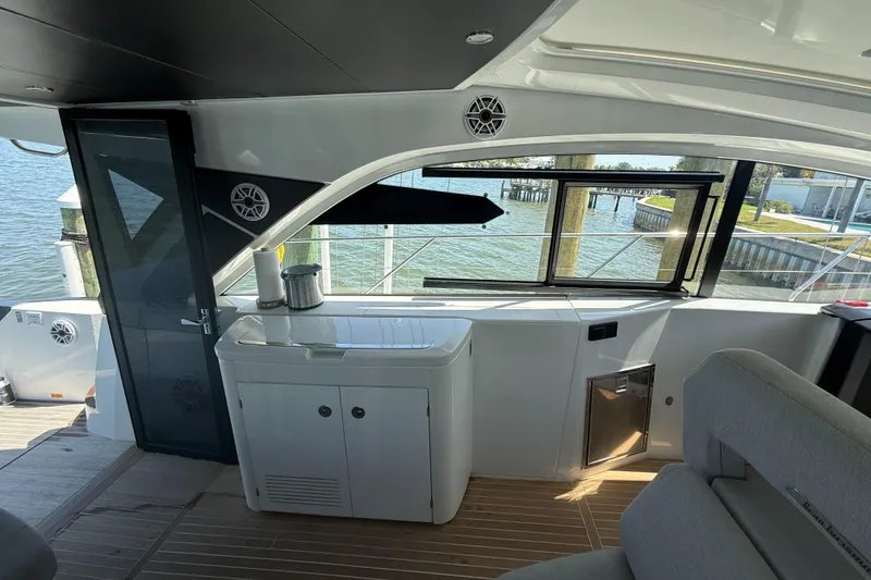 Slide: The Image of Interior of 2023 Beneteau Gran Turismo 45 yacht, featuring sleek design and waterfront view. - 11