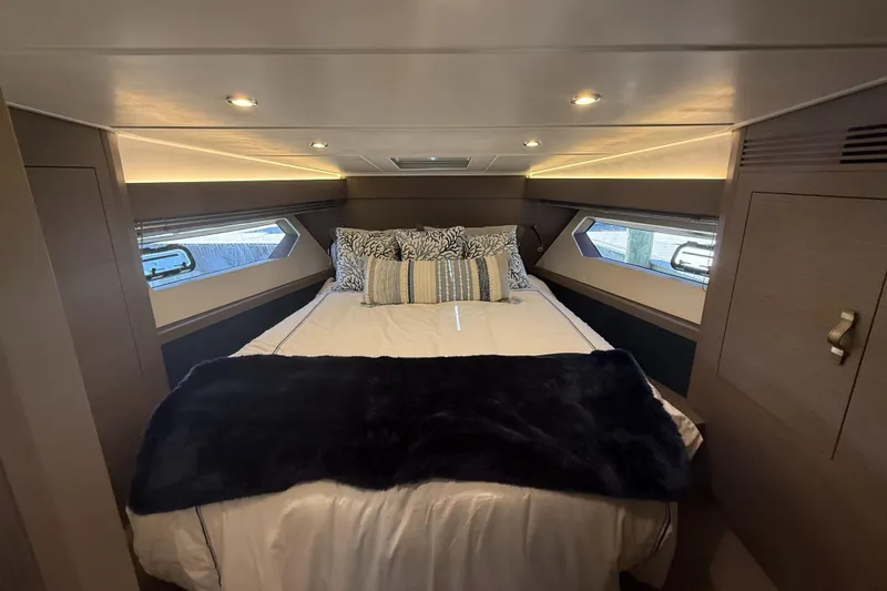 Slide: The Image of Luxurious cabin interior of 2023 Beneteau Gran Turismo 45 yacht with cozy bedding. - 19