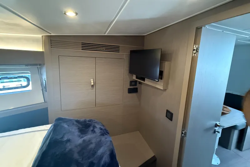 Slide: The Image of 2023 Beneteau Gran Turismo 45 cabin interior with TV and modern furnishings. - 20