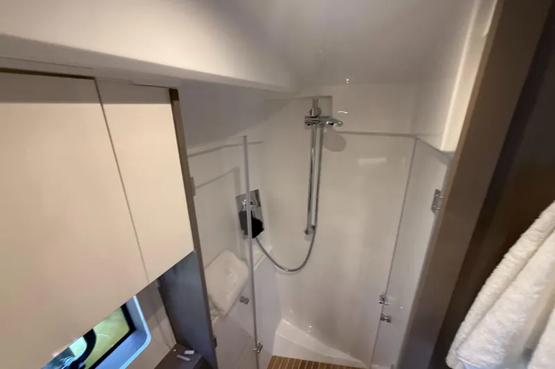 Slide: The Image of 2023 Beneteau Gran Turismo 45 yacht bathroom with modern shower and sleek design. - 23