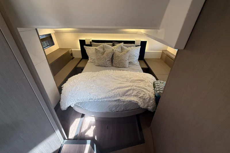 Slide: The Image of Luxurious bedroom interior of 2023 Beneteau Gran Turismo 45 yacht with cozy bedding. - 24