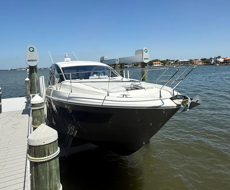 Slide: The Image of 2023 Beneteau Gran Turismo 45 yacht docked by the waterfront. - 6