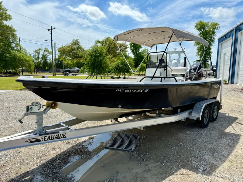 Slide: The Image of 2015 Stott Craft SCV 2160 Bay boat on a trailer, parked outdoors. - 11