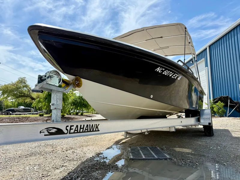 Slide: The Image of 2015 Stott Craft SCV 2160 Bay boat on Seahawk trailer, parked outdoors. - 12