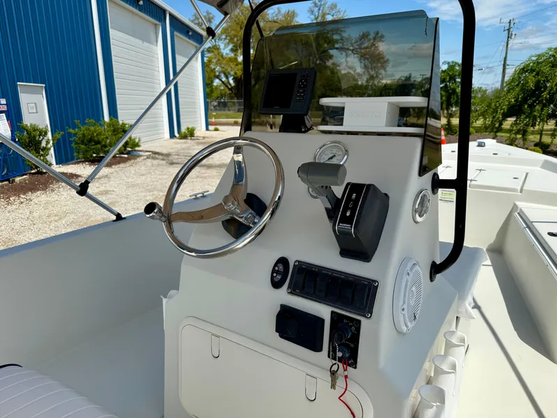 Slide: The Image of 2015 Stott Craft SCV 2160 Bay boat console with steering wheel and controls. - 19