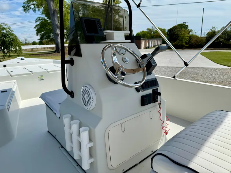Slide: The Image of 2015 Stott Craft SCV 2160 Bay boat console with steering wheel and seating. - 24