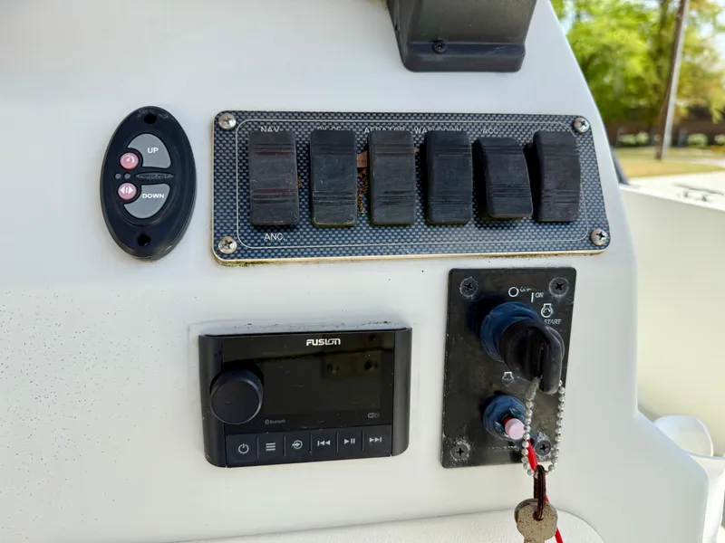 Slide: The Image of Control panel of 2015 Stott Craft SCV 2160 Bay boat with switches and audio system. - 27