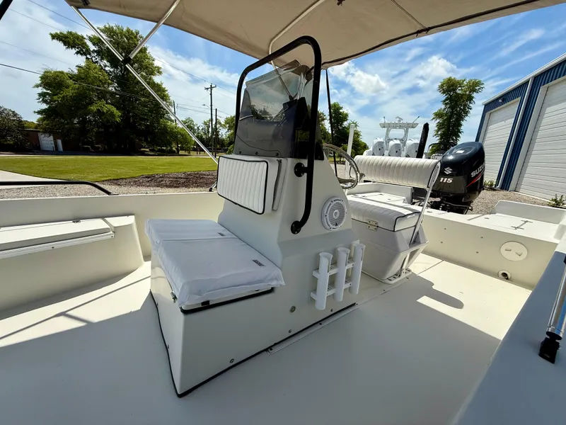 Slide: The Image of 2015 Stott Craft SCV 2160 Bay boat interior with console and seating under canopy. - 28