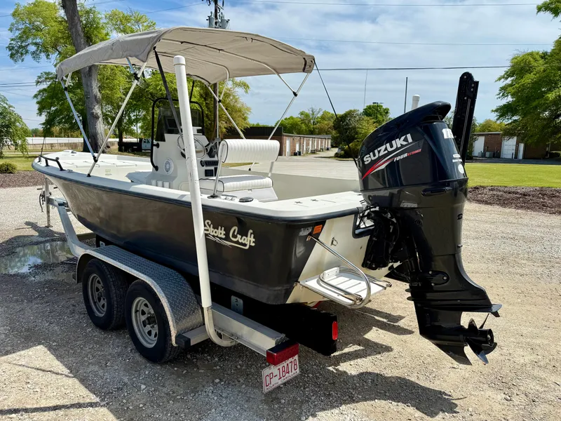 Slide: The Image of 2015 Stott Craft SCV 2160 Bay boat on trailer with Suzuki outboard motor. - 6