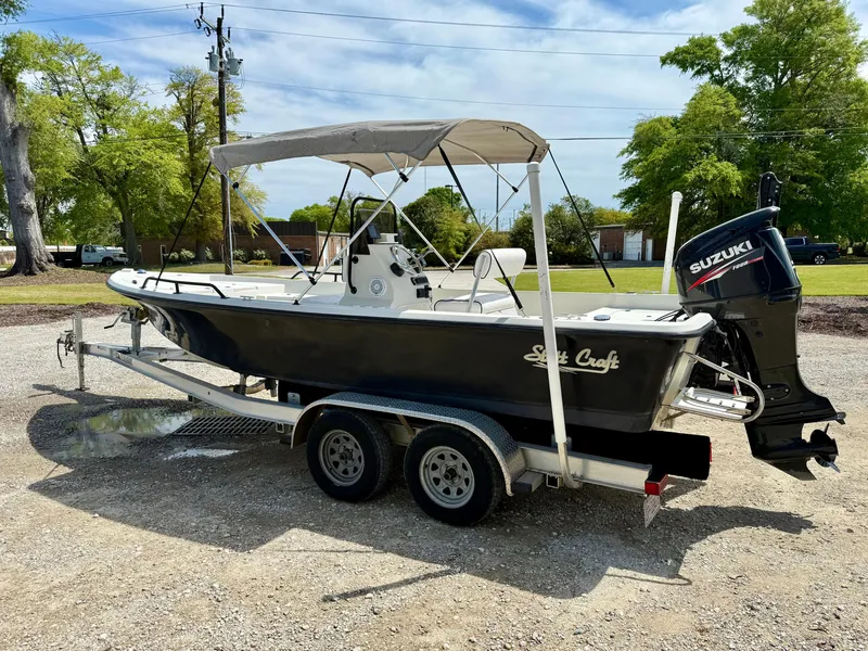Slide: The Image of 2015 Stott Craft SCV 2160 Bay boat on trailer with Suzuki outboard motor. - 8
