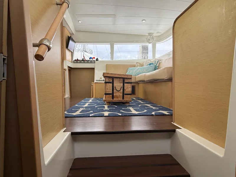 Slide: The Image of Interior of 2010 Lagoon 400 yacht, featuring cozy seating and nautical decor. - 18