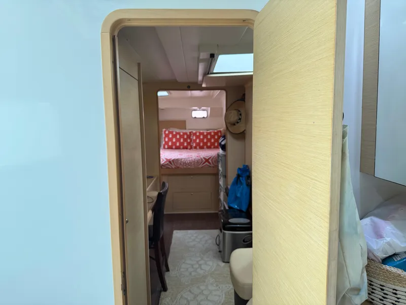 Slide: The Image of Interior view of 2010 Lagoon 400 Owner's Version yacht, featuring cozy cabin and modern amenities. - 31