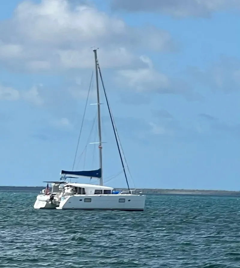 Slide: The Image of 2010 Lagoon 400 catamaran sailing on calm blue waters under a clear sky. - 38