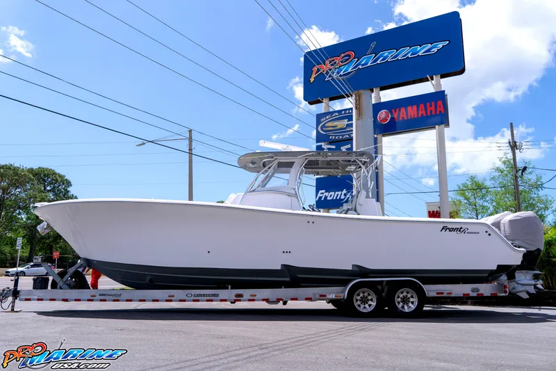 The Image of 2023 Front Runner 36 Center Console boat on trailer at dealership. - 0
