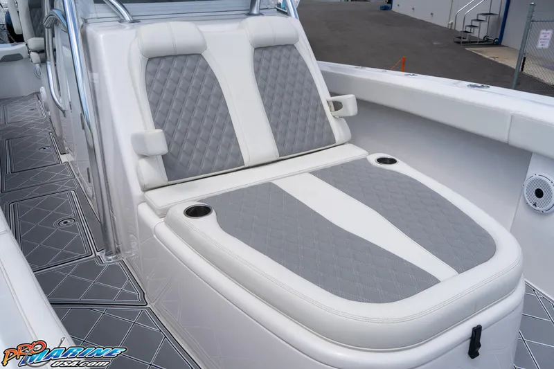 Slide: The Image of 2023 Front Runner 36 Center Console boat with cushioned seating and cup holders. - 10