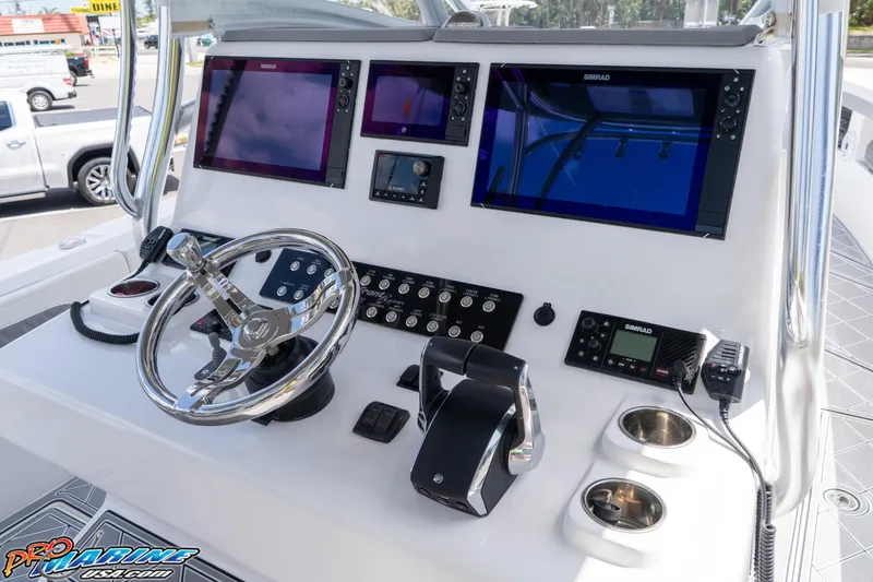 Slide: The Image of 2023 Front Runner 36 Center Console boat dashboard with advanced navigation displays. - 13