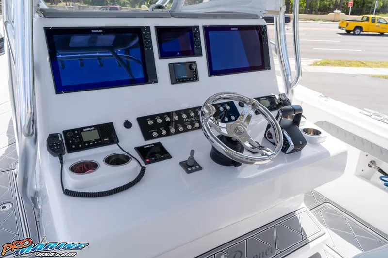 Slide: The Image of 2023 Front Runner 36 Center Console boat dashboard with advanced navigation and control systems. - 14