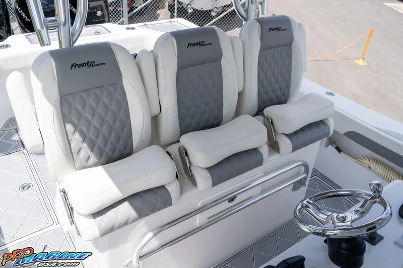 Slide: The Image of 2023 Front Runner 36 Center Console boat seats with gray and white upholstery. - 16