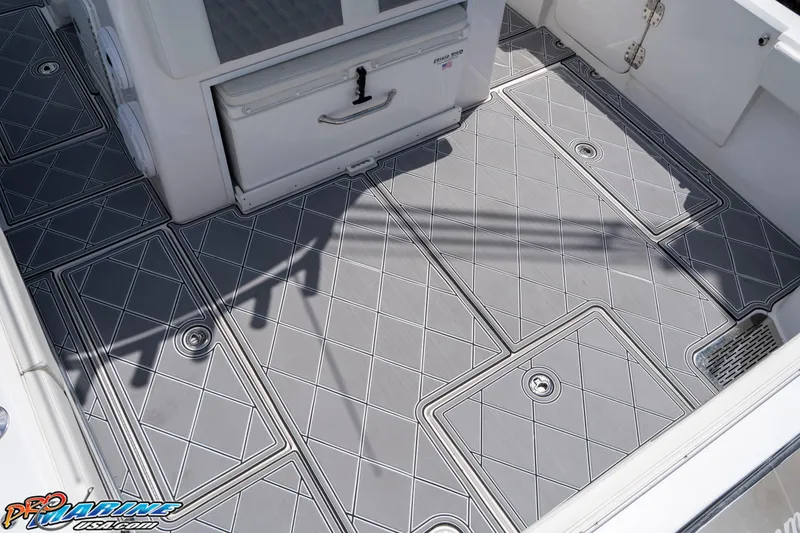 Slide: The Image of 2023 Front Runner 36 Center Console boat deck with gray diamond-patterned flooring. - 19