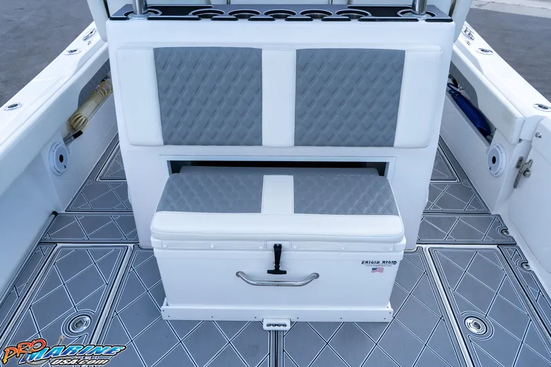 Slide: The Image of 2023 Front Runner 36 Center Console boat interior with cushioned seating and storage. - 23