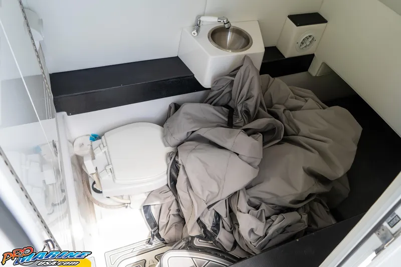 Slide: The Image of Interior of 2023 Front Runner 36 Center Console boat with toilet and sink. - 26